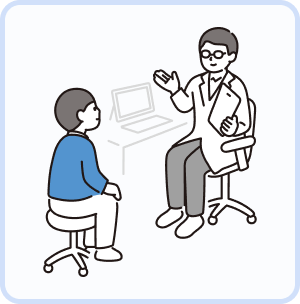 A doctor and patient talking across a desk